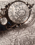 Pendant with natural stone - indian agat, magnifying glass and hand-drawn compass under another magnifying glass. For Men and Women